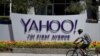 FILE - In this Tuesday, July 19, 2016 file photo, a cyclist rides past a Yahoo sign at the company's headquarters in Sunnyvale, Calif. The Yahoo hack announced Wednesday, Dec. 14, 2016 exposed personal details from more than 1 billion user accounts,…