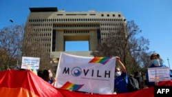 Members of the Homosexual Liberation and Integration Movement (Movilh) hold a vigil outside the National Congress in Valparaiso, Chile, on November 30, 2021