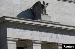 FILE - Federal Reserve Board building on Constitution Avenue is pictured in Washington, March 19, 2019.