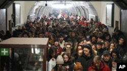 People take shelter in a metro station during an air raid alarm in Kyiv, Ukraine, Dec. 20, 2024.