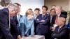 CANADA -- German Chancellor Angela Merkel speaks with U.S. President Donald Trump during the G-7 Leaders Summit in La Malbaie, Quebec, June 9, 2018