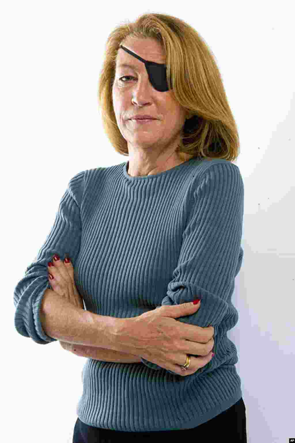 Award-winning American war reporter Marie Colvin was killed on February 22, 2012 by Syrian government shelling against the opposition stronghold of Homs, Syria. She was 57. (AP)