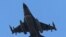 FILE - A missile-loaded Turkish Air Force jet after taking off from Incirlik Air Base, in Adana, southern Turkey, July 29, 2015. 