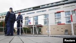 Police officers secure the French Embassy in Berlin a day after the Paris attacks, Nov. 14, 2015.