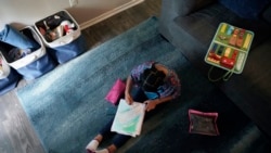 Felicity Brown, 9, creates art as she takes a break from math practice at her home in Austin, Texas, Tuesday, July 13, 2021. After homeschooling during the pandemic, the Brown family have started homeschooling their kids permanently using a Catholic-based curriculum and won't be sending them back to in-person schools this fall. (AP Photo/Eric Gay)