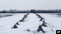 FILE - A concrete anti-tank line is seen on a field near Avdiivka, Donetsk region, eastern Ukraine, Feb. 5, 2017.