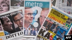 A photo taken on September 10, 2018 in Stockholm shows a selection of front pages of Swedish newspapers in Stockholm a day after the general elections.