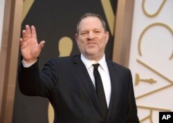 FILE - Harvey Weinstein arrives at the Oscars in Los Angeles, California, March 2, 2014.