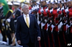 U.S. Secretary of Defense Jim Mattis receives military honors before his meeting with Brazil's defense minister, in Brasilia, Brazil, Aug. 13, 2018.