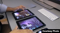 Programmer Derrick Baxter demonstrates the Ojibway Language app, designed to teach Ojibwe children their ancestral language.