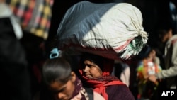 Passengers are pictured at India's New Delhi railway station on Feb. 16, 2025. 