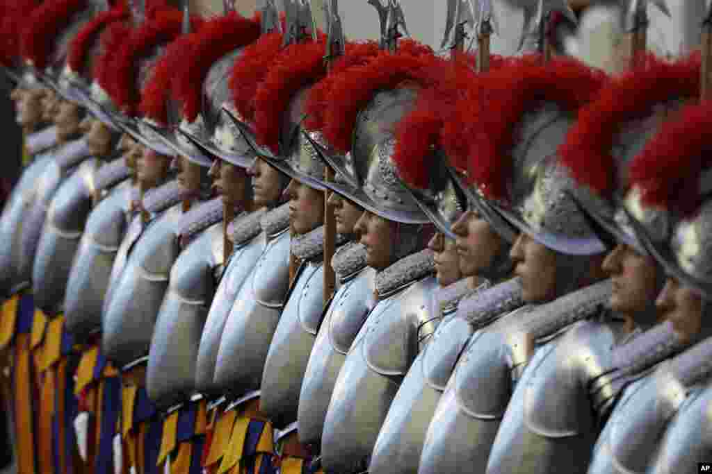 Swiss Guards stand attention at the St. Damaso courtyard on the occasion of the swearing-in ceremony at the Vatican.