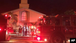 Firefighters work at the scene of a blaze at the Islamic Center of Fort Pierce, Florida, Sept. 12, 2016. (St. Lucie Sheriff's Office via AP)