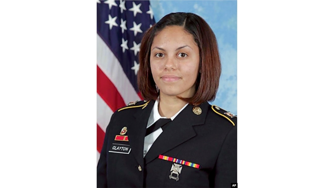In this undated photo released by the U.S. Army, U.S. Army combat camera photographer Spc. Hilda Clayton poses for a photo.