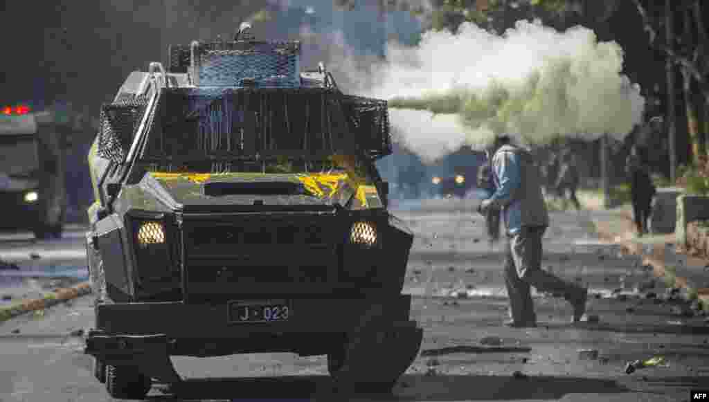 Riot police disperse students protesting against the slowness in the progress of the Chilean education reform, in Santiago.