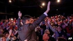 FILE - French conservative presidential candidate Francois Fillon, waves as he arrives to deliver his speech during a rally in Orleans, central France, Tuesday, March 7, 2017. 