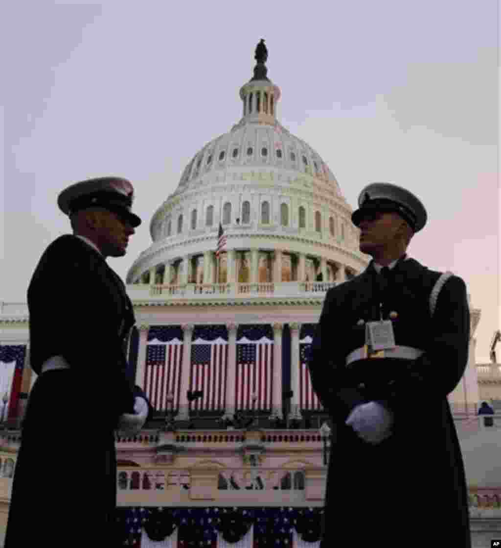 Ceremonial Coast Guard honor guards stand in front of the U.S. Capitol before the ceremonial swearing-in of President Barack Obama during the 57th Presidential Inauguration in Washington, Monday, Jan. 21, 2013. (AP Photo/Evan Vucci)