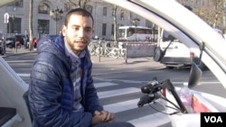 Taxi bike driver Mohamed Nachait expresses concern over terrorism's possible impact on France's tourism industry, in Paris, Nov. 15, 2015. (Photo - L. Bryant/VOA)