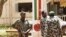 Malian junta soldiers stand guard at their headquarters in Kati, outside Mali's capital Bamako, April 1, 2012.