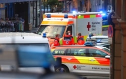 Emergency services vehicles are seen at the site of a knife attack, in Wuerzburg, Germany, June 25, 2021.