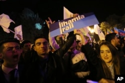 Supporters of Azerbaijan's President Ilham Aliyev celebrate his victory in the presidential elections in Baku, Azerbaijan, April 11, 2018