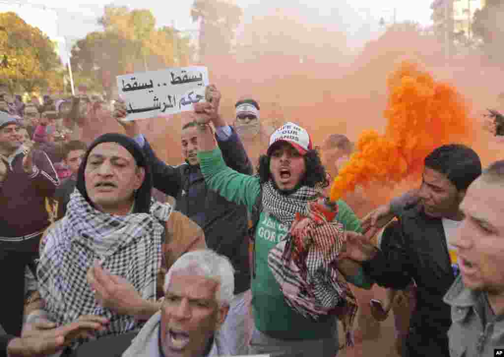 Egyptians shout slogans during anti-President Mohamed Morsi protest in front of the presidential palace in Cairo, Egypt, Feb. 1, 2013.