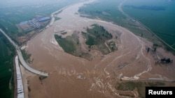 An aerial view shows that roads and fields are flooded in Xingtai, Hebei Province, China, July 21, 2016.