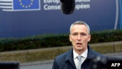 NATO Secretary General Jens Stoltenberg talks to the media upon his arrival to attend a European Union summit at the European Council building in Brussels, Dec. 15, 2016.