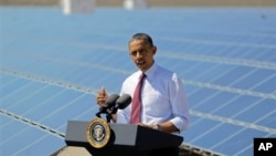 FILE - President Barack Obama speaks after touring a solar panel facility, Boulder City, Nevada, March 21, 2012.