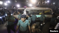 An ambulance carrying the body of Salauddin Quader Chowdhury, a leader of the Bangladesh Nationalist Party, leaves the Dhaka Central Jail after his execution, Nov. 22, 2015.