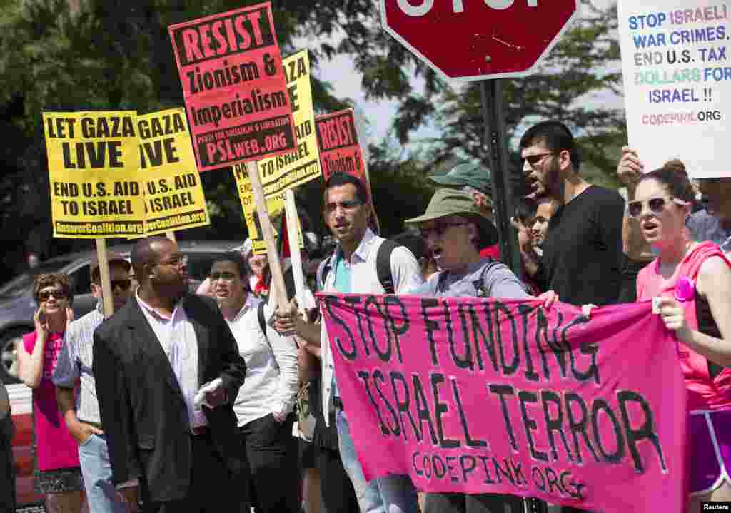 Protesters call for an end to the Israeli airstrikes on Gaza during a demonstration in front of the Israel Embassy, in Washington, July 11, 2014.