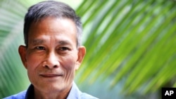FILE - Vietnamese blogger Nguyen Van Hai, pictured in October 2014, says it's time "for everyone to sit down to find ways to restore" his country, but "everyone must have a voice in the process." 