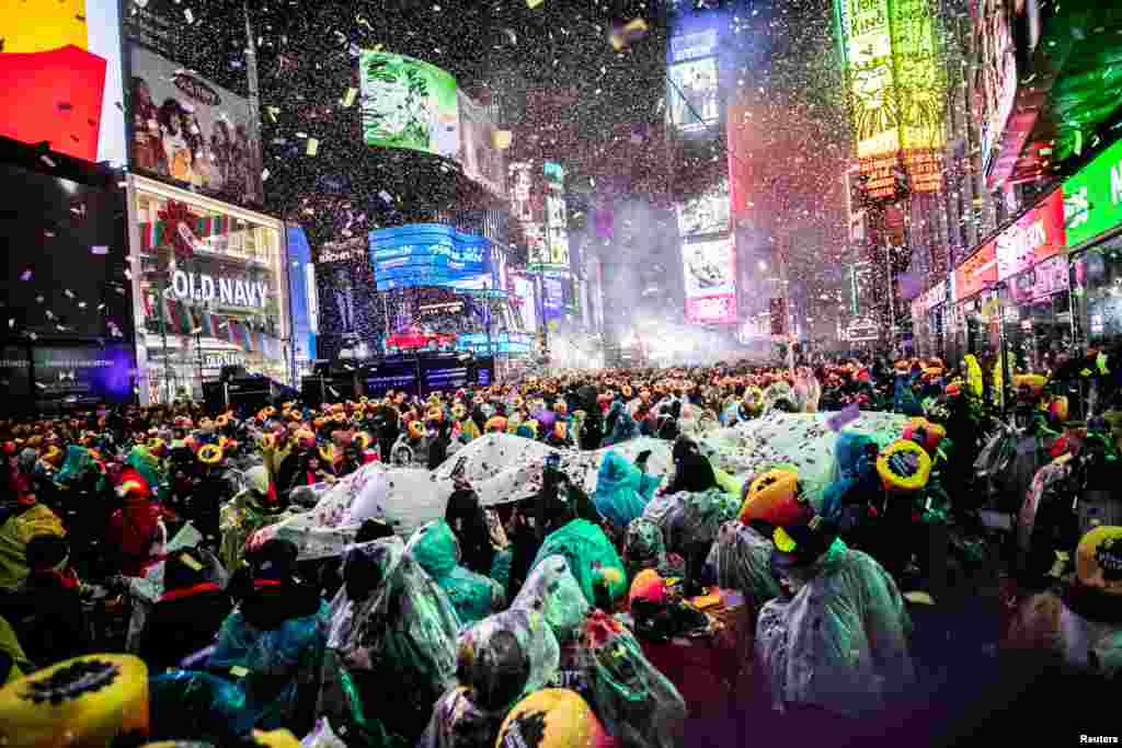 Revelers get ready to welcome the New Year in Times Square, New York, Dec. 31, 2018.