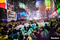 Revelers get ready to welcome the New Year in Times Square, New York, Dec. 31, 2018.