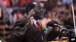 FILE: Zimbabwean President Robert Mugabe attends a meeting with the country's war veterans in Harare, April, 7, 2016.