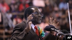 FILE: Zimbabwean President Robert Mugabe attends a meeting with the country's war veterans in Harare, April, 7, 2016.
