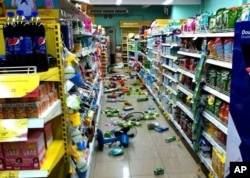 Goods at a grocery store that have fallen from shelves litter the floor after an earthquake in Chiang Rai province, northern Thailand, on May 5, 2014.