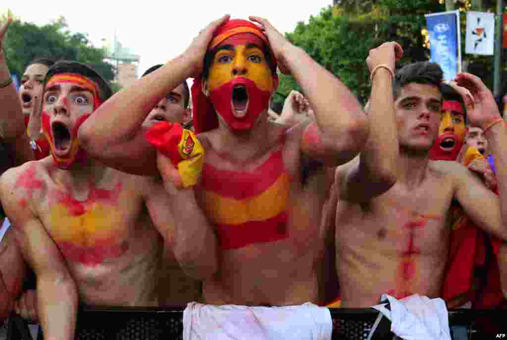 July 11: Spain's soccer fans react as they watch a public screening of the World Cup 2010 final soccer match between Spain and the Netherlands in downtown Madrid. (Andrea Comas/Reuters)