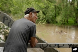Elmer Sullivan checks out high water in the Fishing River in Mosby, Missouri, May 8, 2019.