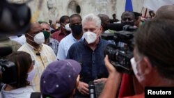 FILE - Cuban President Miguel Diaz-Canel talks to the media, in San Antonio de los Banos, Cuba, July 11, 2021.