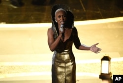 Cynthia Erivo performs "Stand Up" nominated for the award for best original song from "Harriet" at the Oscars on Sunday, Feb. 9, 2020, at the Dolby Theatre in Los Angeles. (AP Photo/Chris Pizzello)