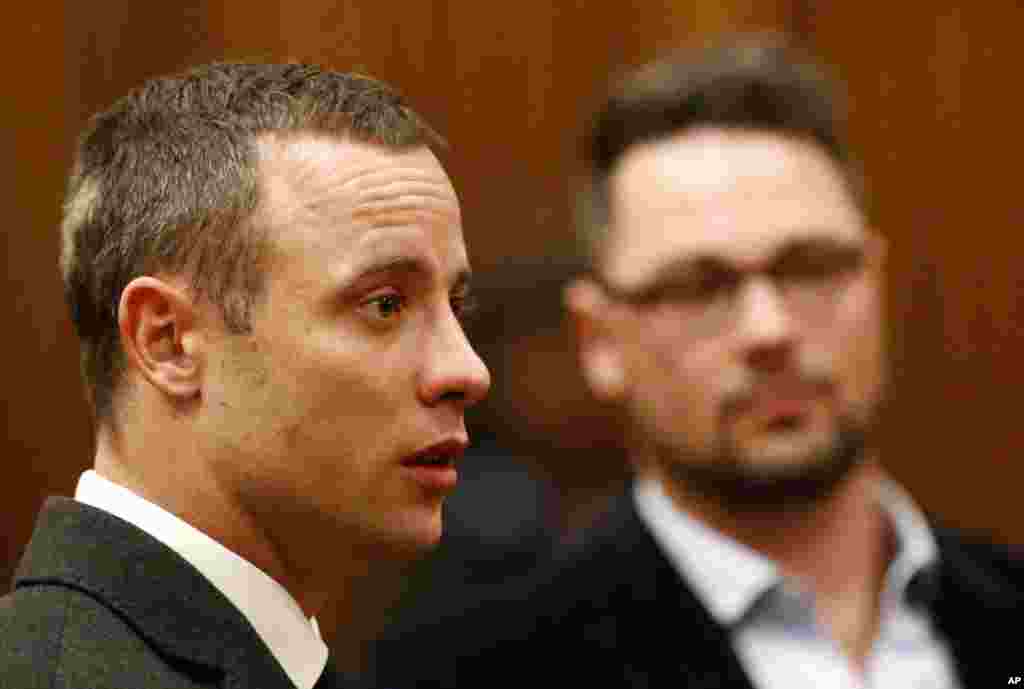 Oscar Pistorius listens as a court ruling is handed down. The ruling stated that he would undergo psychiatric evaluation in Pretoria, South Africa, May 20, 2014.