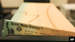 FILE - Trays of printed Social Security checks wait to be mailed from the U.S. Treasury's Financial Management services facility in Philadelphia.