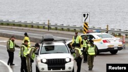 Canadian police check a car next to the red zone security perimeter around the Manoir Richelieu ahead of G7 Summit in La Malbaie, Canada, June 5, 2018. 