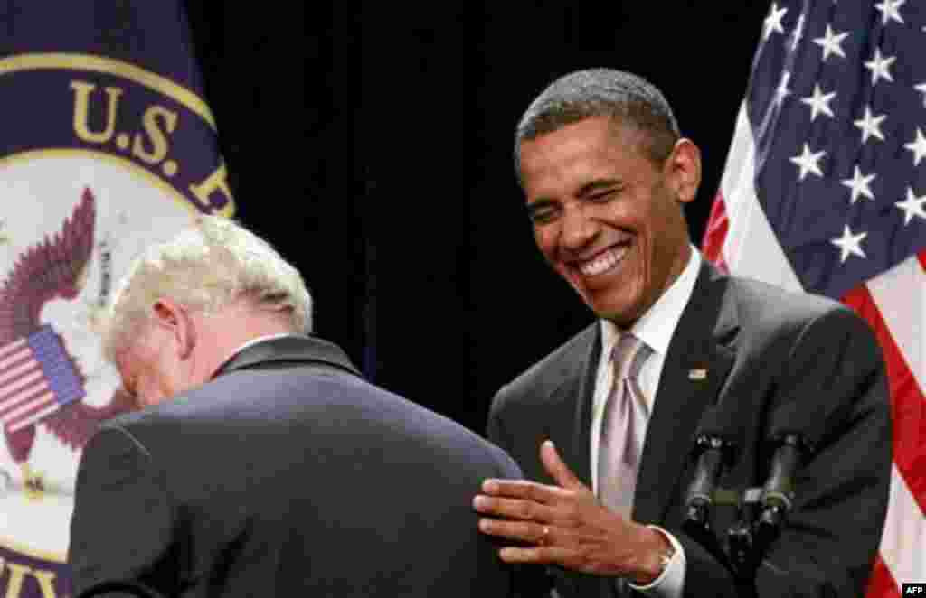 President Barack Obama shares a laugh as he is introduced by Rep. John Larson, D-Conn., before speaking at the House Democratic Issues Conference, Friday, Jan. 27, 2012, in Cambridge, Md. (AP Photo/Haraz N. Ghanbari)