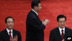 Chinese President Hu Jintao, right, Premier Wen Jiabao, left, and Vice President Xi Jinping, in Beijing, (May 4, 2012 file photo)