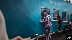  Visitors by their tickets for the Olympic Park at the 2012 Summer Olympics, London, July 29, 2012. 