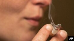FILE - Authors of a new study found that people with schizophrenia started smoking at a younger age than other smokers, before psychotic symptoms appeared.