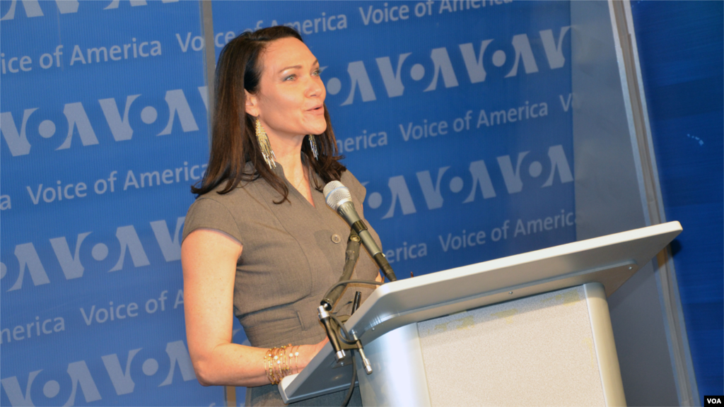 Heather Maxwell, who took over for Leo as host of "Music Time in Africa" in 2012, speaks at the studio dedication ceremony.