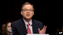 FILE - Kevin Hassett, pictured in December 2012 as he testified on economic policy on Capitol Hill in Washington, will become President Donald Trump's Council of Economic Advisers chairman.